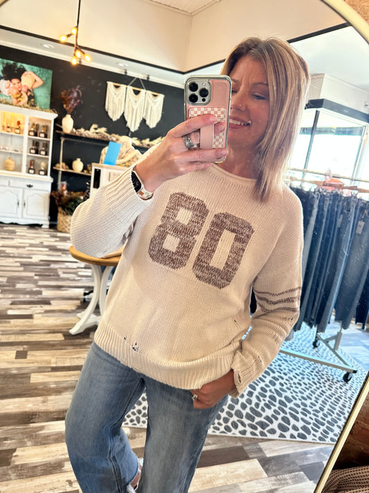 Distressed Long Sleeve Varsity Knit Top