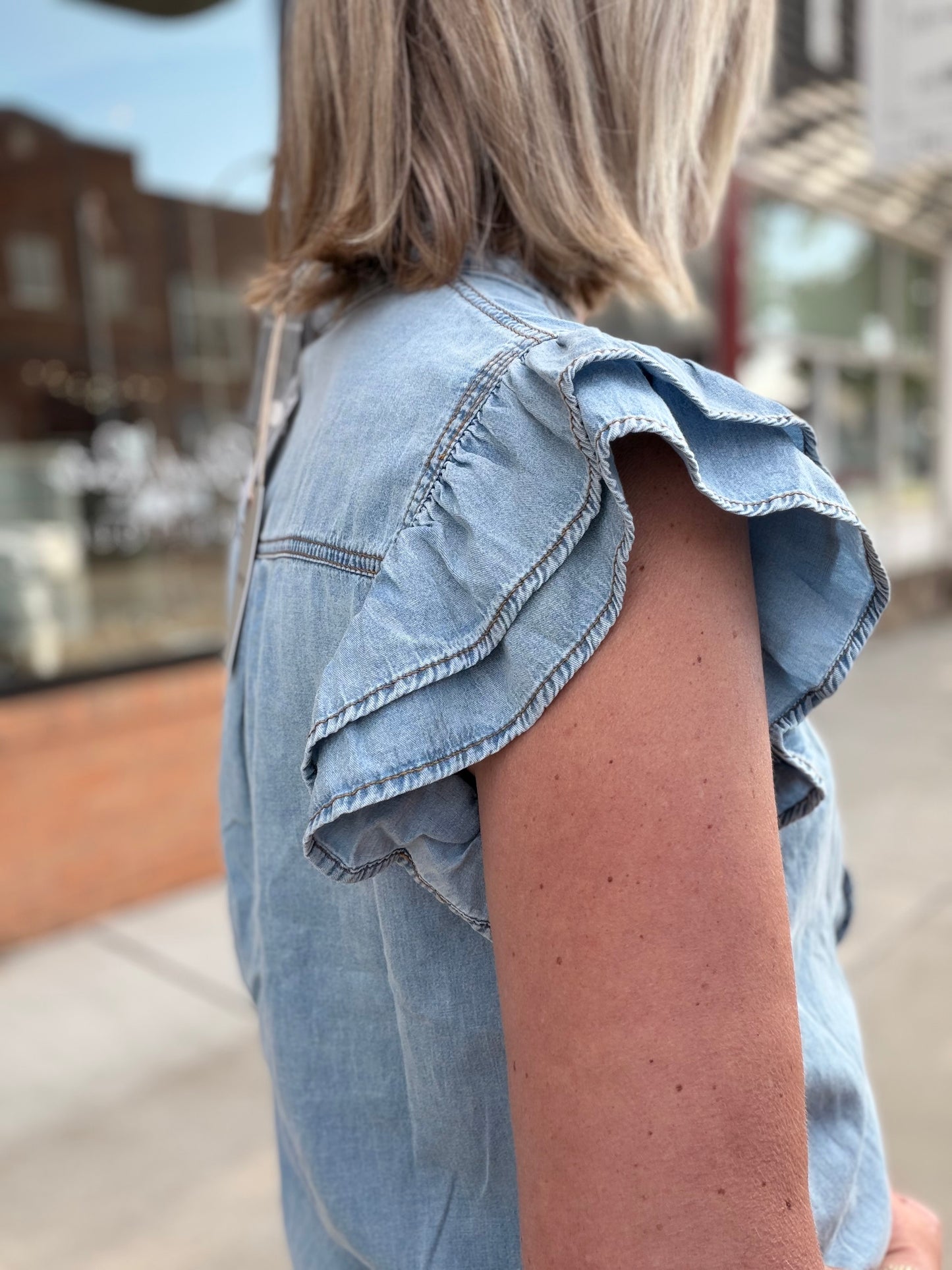 The Faye Washed Denim Ruffle Top