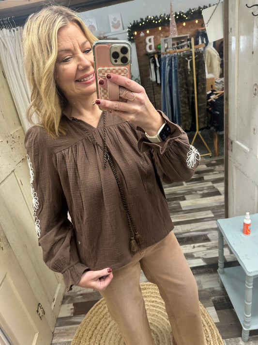 The Dari Flower Embroidery Tassel Trim Babydoll Blouse