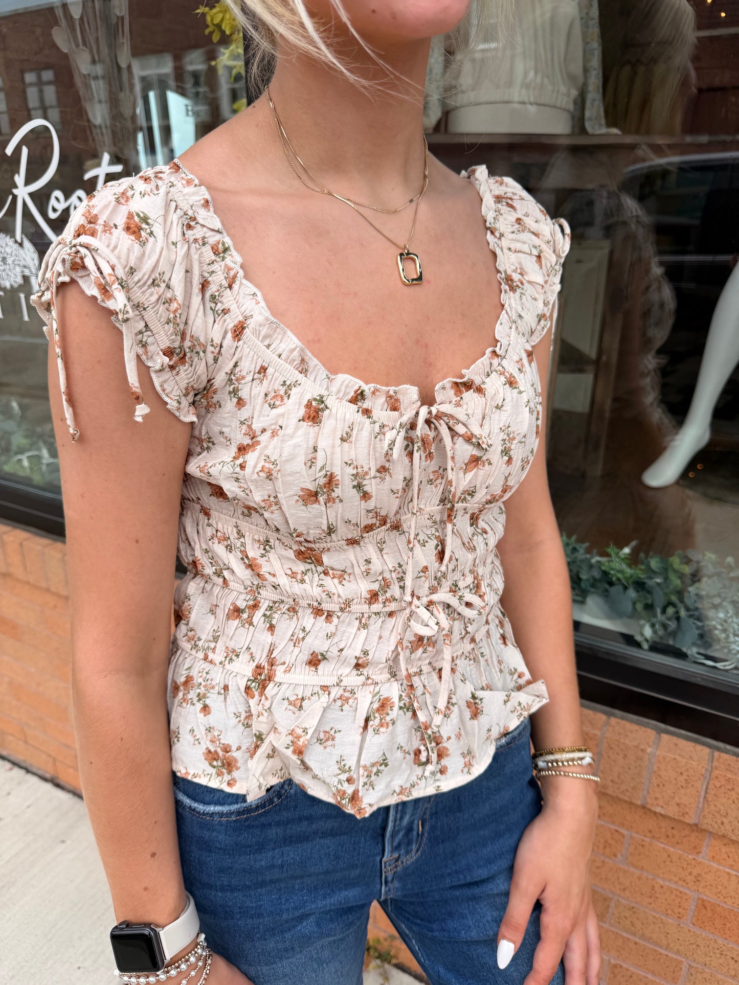 The Allie Floral Tie Shirred Waist Ruffled Top