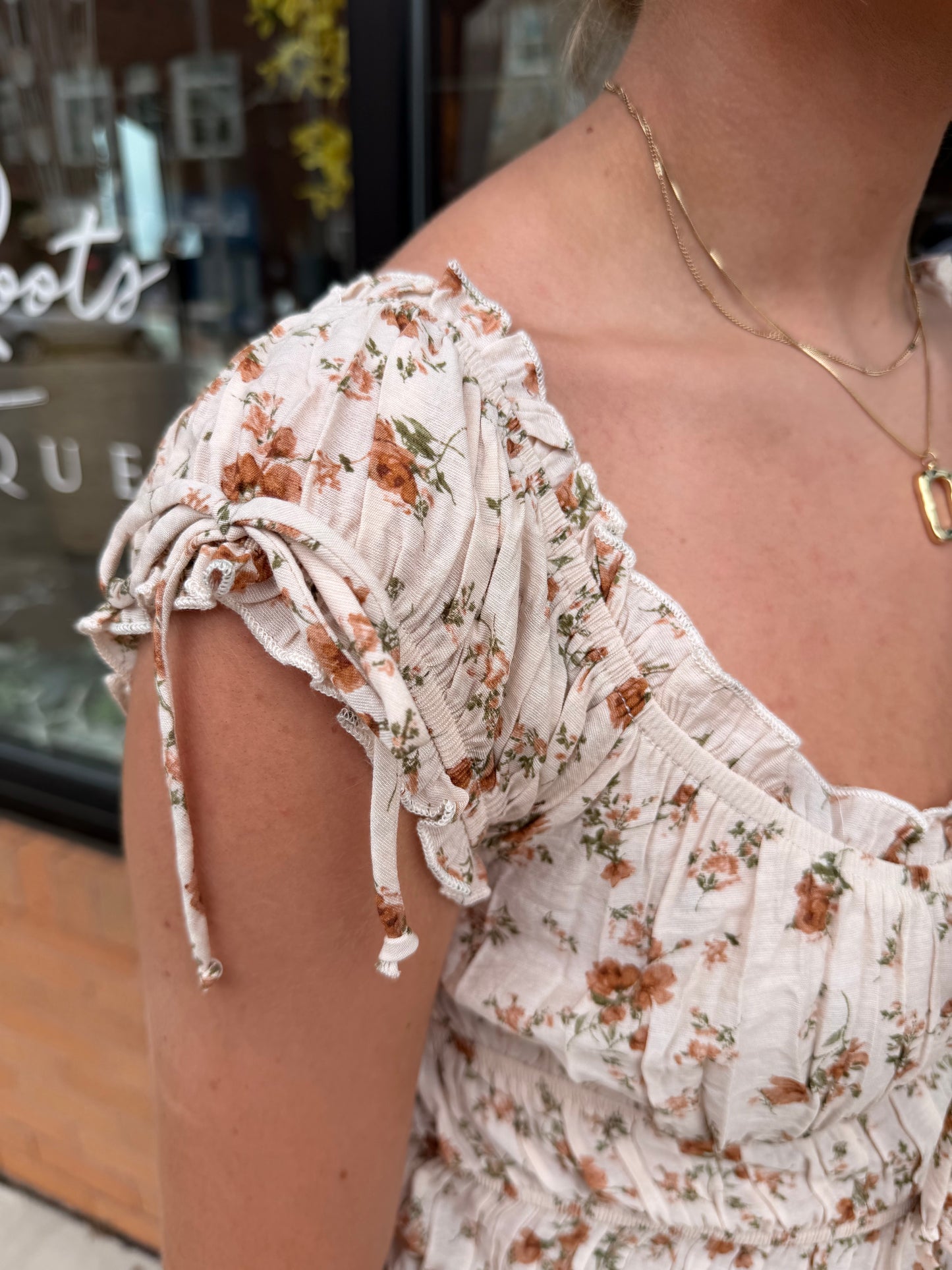 The Allie Floral Tie Shirred Waist Ruffled Top